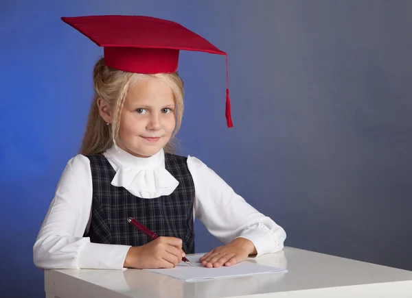 Schoolgirl writes — Stock Photo, Image