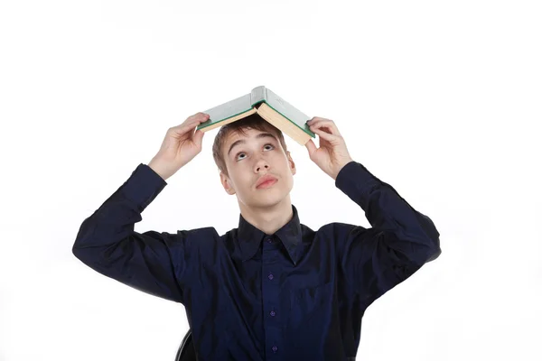 Teenager with book on white background — Stock Photo, Image