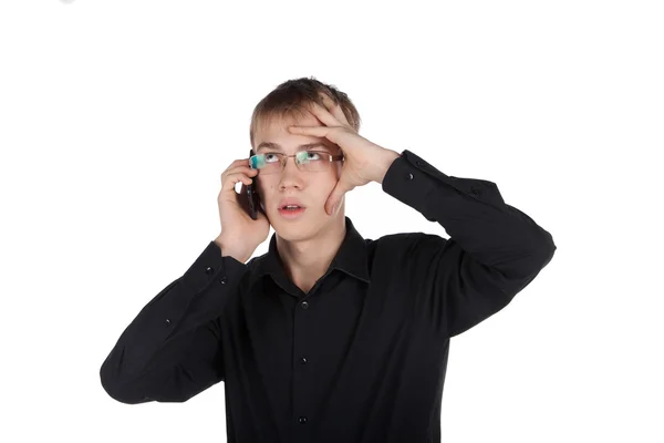 Teenager mit Brille telefoniert nachdenklich — Stockfoto