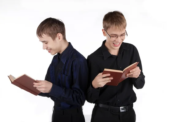 Two teenagers reading a book — Stock Photo, Image