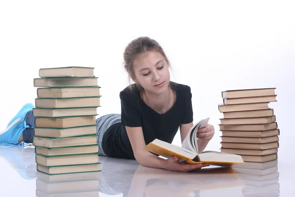 Adolescente con libros sobre fondo blanco —  Fotos de Stock