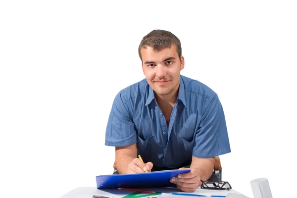 A young man at a table with a folder in hands on a white backgro Stock Picture