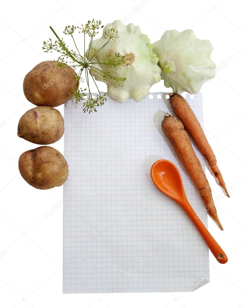vegetables around the leaf of notebook
