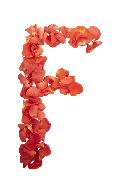 Буква F лепестков роз — стоковое фото