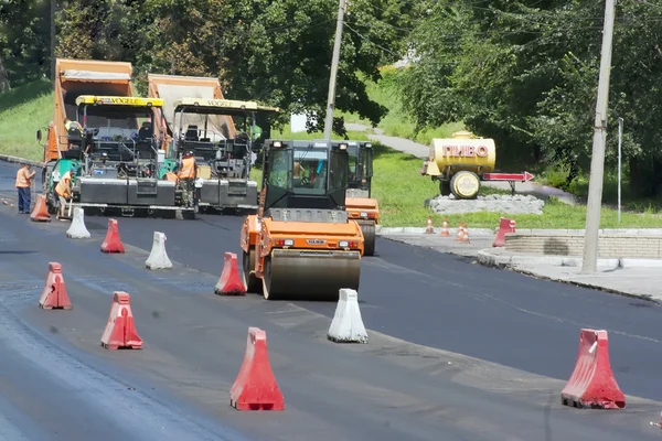 Workers laid asphalt on road