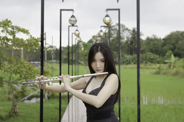 Beautiful Woman Holding Flute Hand Portrait Model Posing Blurry Light — Stockfoto