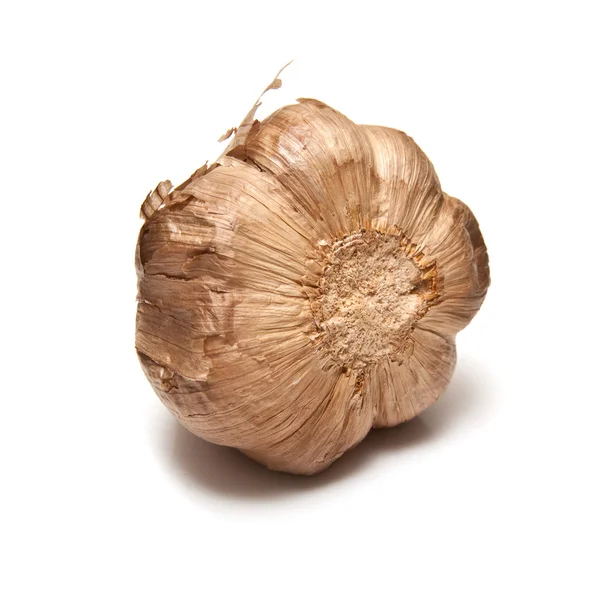 Smoked black garlic isolated on a white studio background. — Stock Photo, Image
