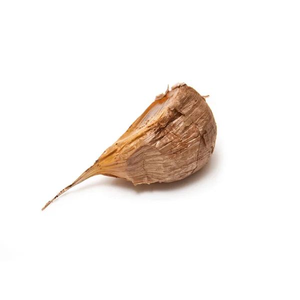 Smoked black garlic isolated on a white studio background. — Stock Photo, Image