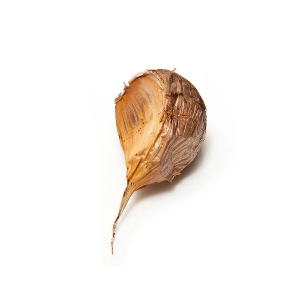 Smoked black garlic isolated on a white studio background. — Stock Photo, Image