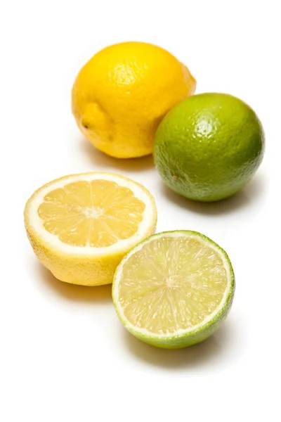 Lemons and Limes isolated on a white studio background. — Stock Photo, Image