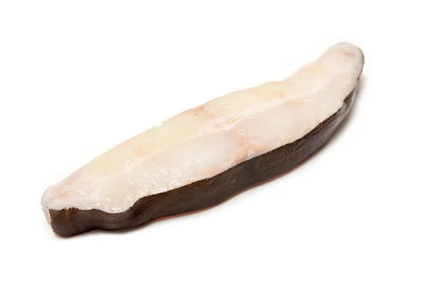 Halibut fish steak isolated on a white studio background. — Stock Photo, Image