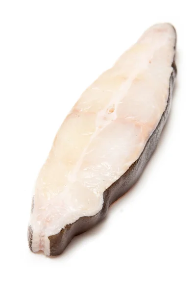 Halibut fish steak isolated on a white studio background. — Stock Photo, Image