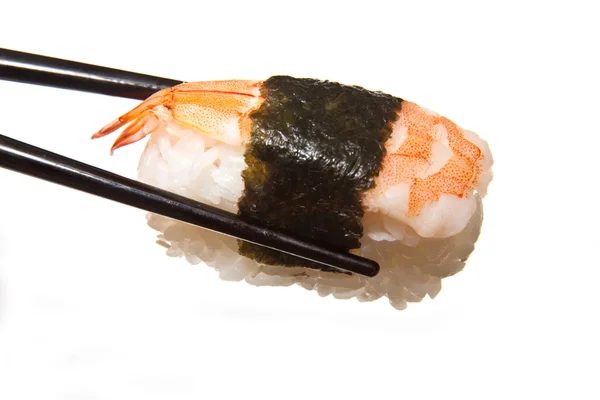 Drží sushi hůlkami — Stock fotografie