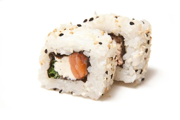 Holding sushi with chopsticks — Stock Photo, Image