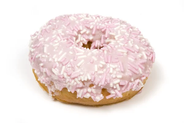 Розовый пончик, покрытый брызгами — стоковое фото