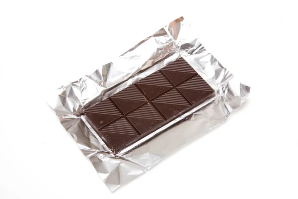 Čokoláda v stříbrné fólie — Stock fotografie