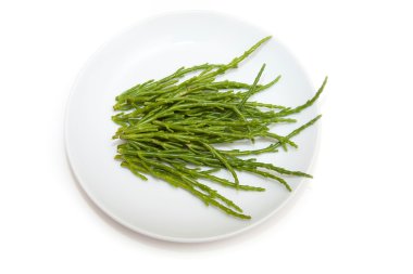 Plate of Samphire isolated on a white studio background. clipart