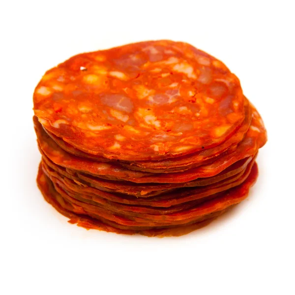 Sliced chorizo sausage isolated on a white studio background. — Stock Photo, Image