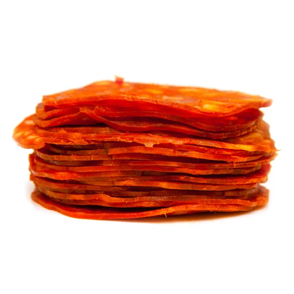 Sliced chorizo sausage isolated on a white studio background. — Stock Photo, Image
