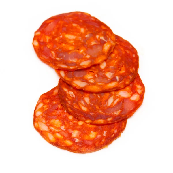 Sliced chorizo sausage isolated on a white studio background. — Stock Photo, Image