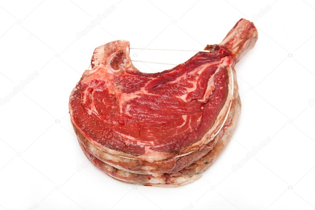 Rib of beef joint isolated on a white background.