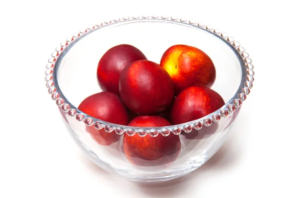 Nectarines in glass bowl — Stock Photo, Image