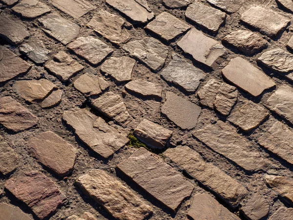 Vista aérea de la textura de la calle adoquinada. Textura pavimento piedra — Foto de Stock