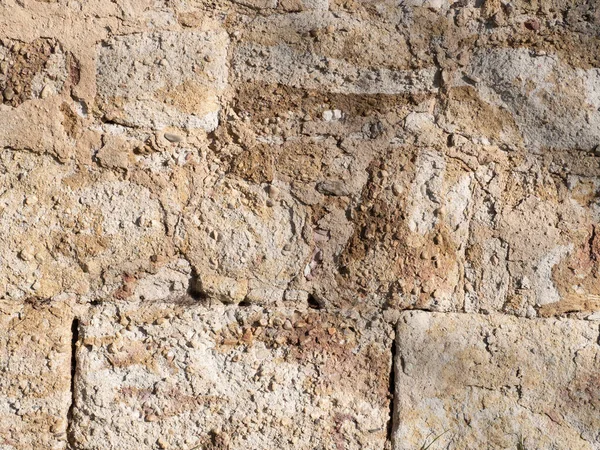 Textura de una vieja pared de piedra amarilla — Foto de Stock