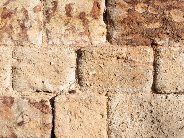 Textura de una vieja pared de piedra amarilla — Foto de Stock