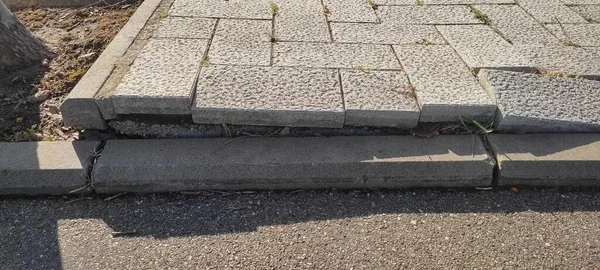 Old defective cobblestone pavement due to incorrectly prepared base — Stockfoto