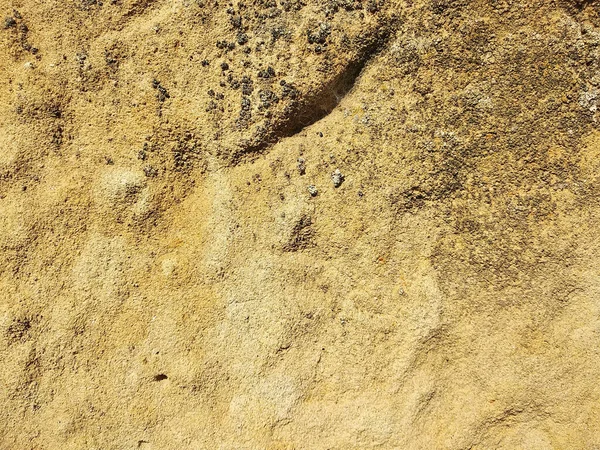 Texture of a yellow sand wall worn down by time — Fotografia de Stock