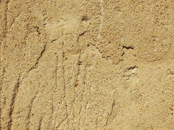 Texture of a yellow sand wall worn down by time — Stock Photo, Image