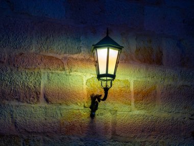 aged street lighting lamp in Germany. Image in old color style . High quality photo