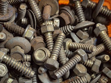 group of rusty screws in a box due to the passage of time. HD image