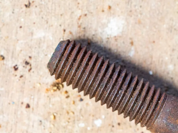 badly worn rusty screw on an antique wood background HD image