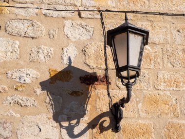 antique street lamp in a Romanesque building in a European city. hd image