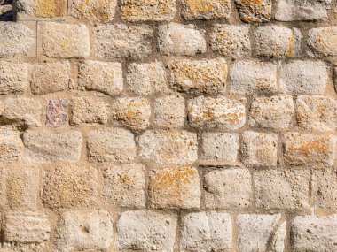 texture of an old stone wall in a historic building in europe. hd image