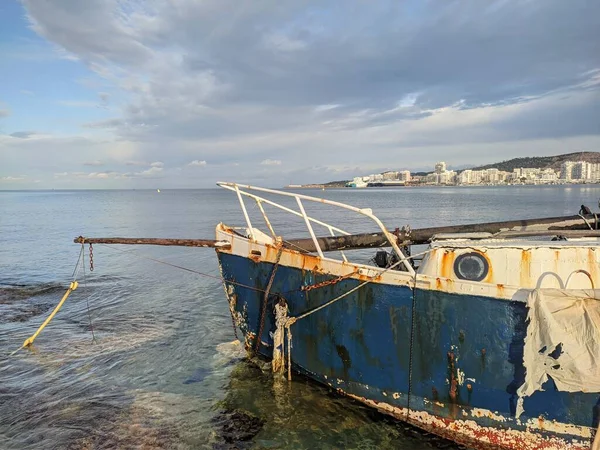 shipwreck on a beach after a storm. Insurance concept. High quality photo