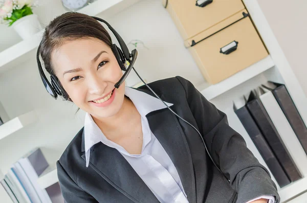 Business women with headphone — Stock Photo, Image