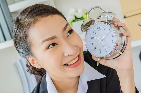 Young business women with clock — Stock Photo, Image