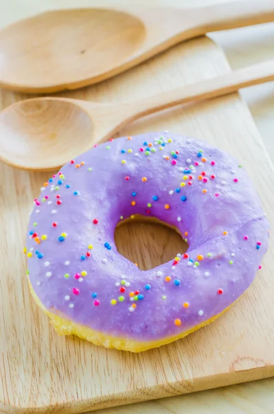 Donut on the wood table — Stock Photo, Image