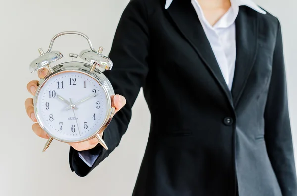 Clock on bussiness hand — Stock Photo, Image