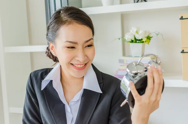 Young business women with clock — Stock Photo, Image