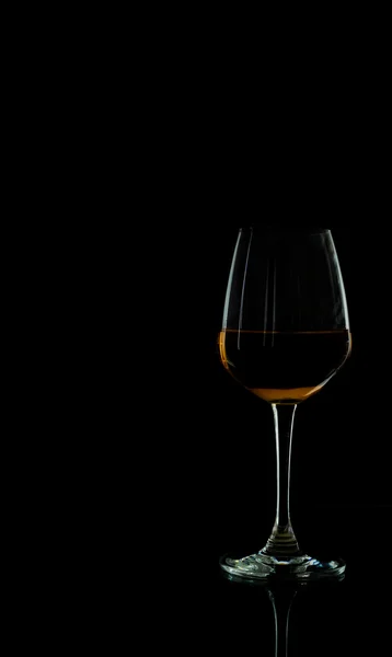 Wine glass in blackdrop — Stock Photo, Image