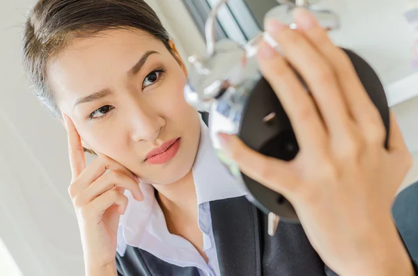 Young business women with clock — Stock Photo, Image