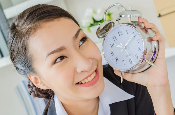 Young business women with clock — Stock Photo, Image