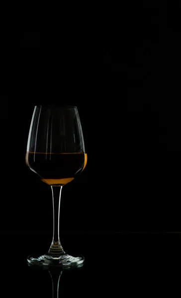 Wine glass in blackdrop — Stock Photo, Image