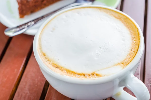 Café caliente sobre mesa de madera —  Fotos de Stock