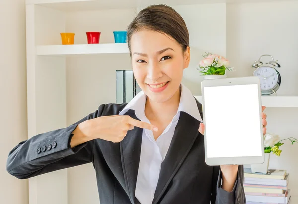 Young business women show empty tablet — Stock Photo, Image