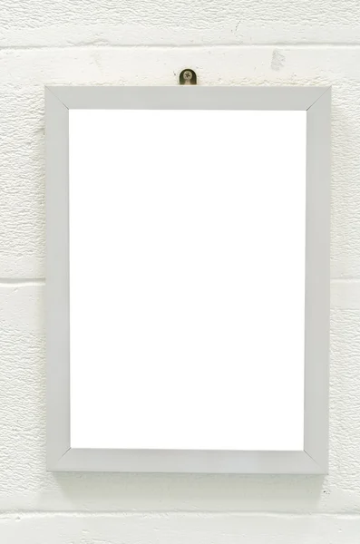 Empty wood frame on white wall — Stock Photo, Image